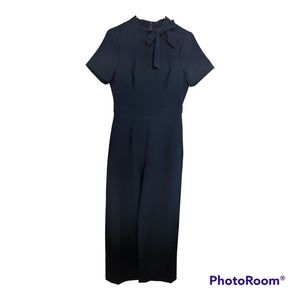 Maggie London navy tie-neck puff sleeve jumpsuit with pockets size 6 NWT